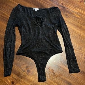 Sparkly unitard shirt that snaps with tie front